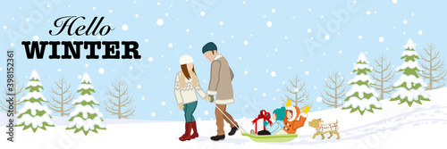 Young family in winter nature, included greeting words "Hello WINTER"