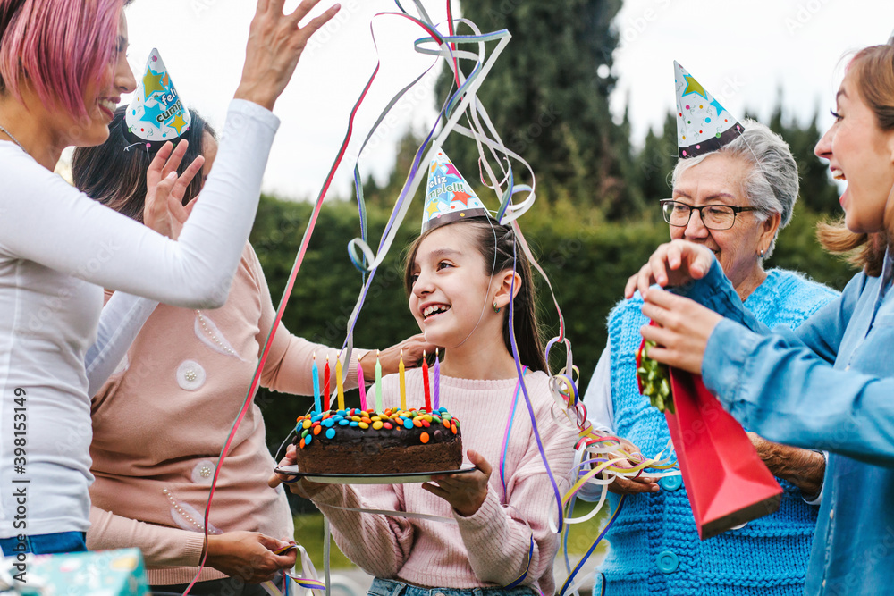 Hispanic Family Celebrating A Latin Girl In A Happy Birthday Party