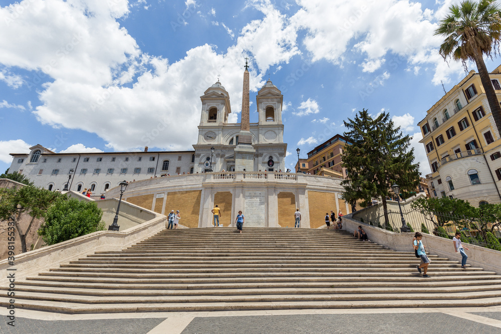 Facade view of The church of the Santissima Trinità dei Monti against blue sky above Spanish Steps, Rome, Italy