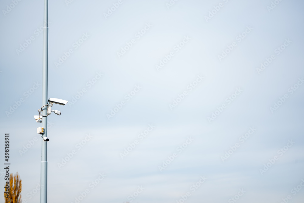 Security cctv cameras on a pole with blue sky background cloudy