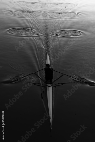 Black and white kayak closeup top view sports rowing water ripples dramatic scene in Plovdiv, Bulgaria