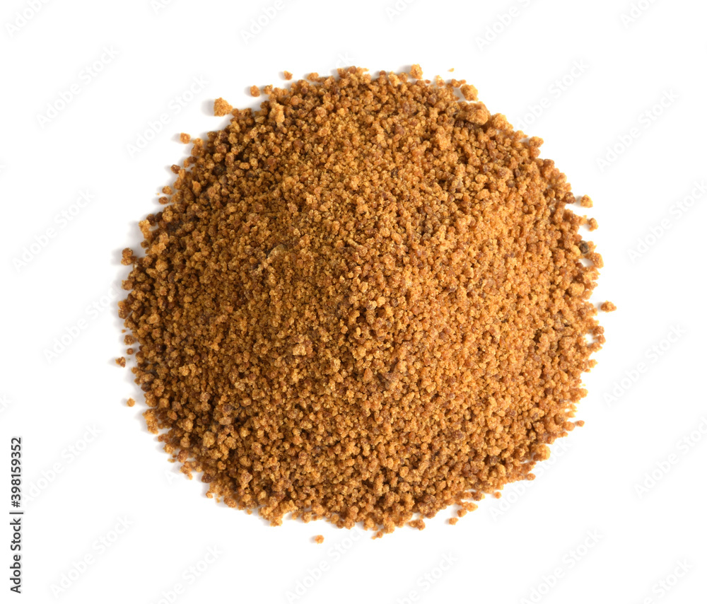 Closeup on a heap of Coconut Sugar. Top View. Isolated on White. Dehydrated Sap of the Coconut Palm Tree. Closeup on a heap of Coconut Sugar. Top View. Isolated on White. Dehydrated Sap of the Coconut Palm Tree.