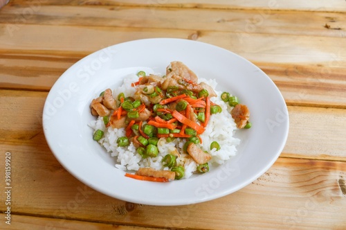 pork and vegetable fried on hot rice - Thailand healthy food