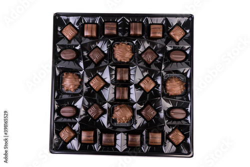 Εκτύπωση καμβά Top down view of collection of milk and dark striped chocolates in a shiny brown