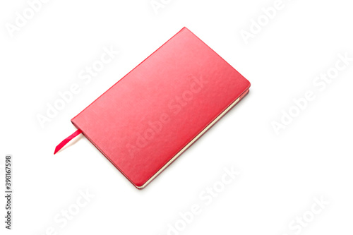 Red blank notebook on white