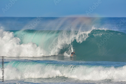 Fototapeta Naklejka Na Ścianę i Meble -  Surfing on the Northshore during large winter wave swells on Oahu, Hawaii