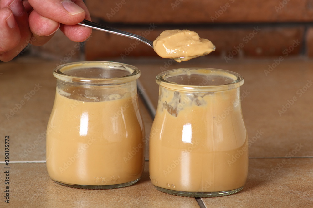 Eating milk pudding dessert in jar and cookies Eating milk pudding dessert in jar and cookies