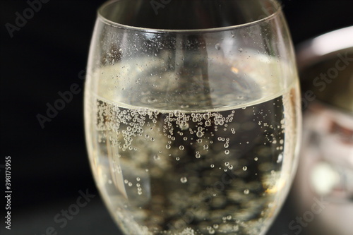 White wine glass with sparkling wine photo