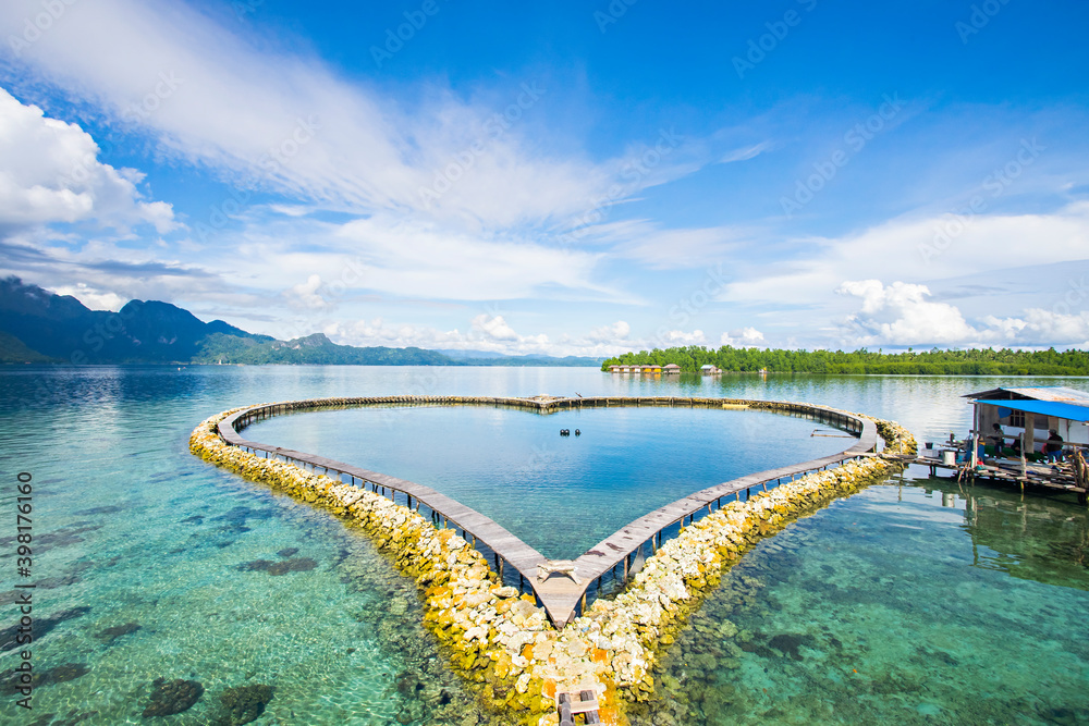 Beautiful love shape pool in the middle of Ora ocean, Seram Island, Maluku, Indonesia.