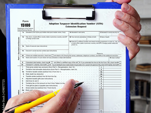 Form 15100 Adoption Taxpayer Identification Number (ATIN) Extension Request inscription on the piece of paper.