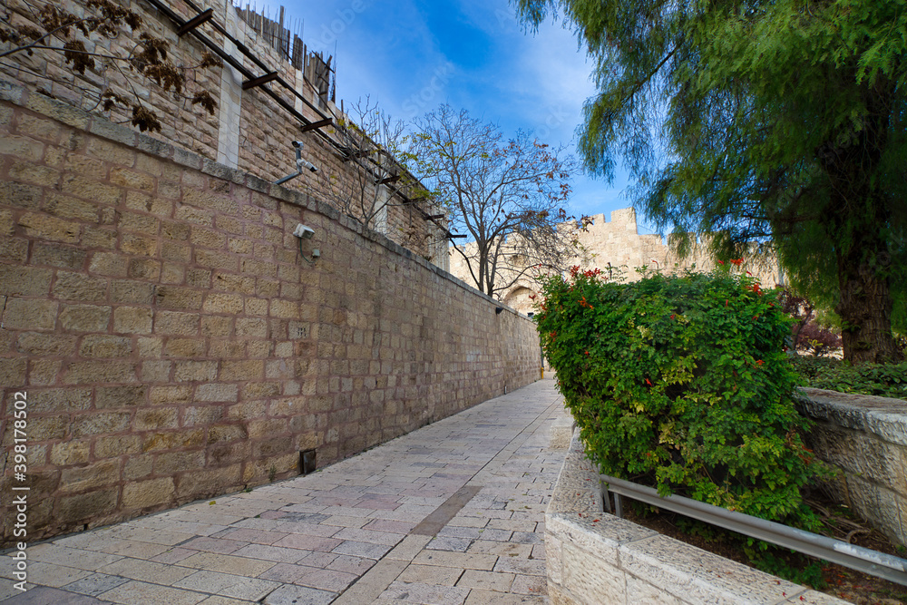 jerusalem, israel. 04-12-2020. Narrow alleys with ancient Jerusalem stone houses, trees and gardens. In the Jewish Quarter