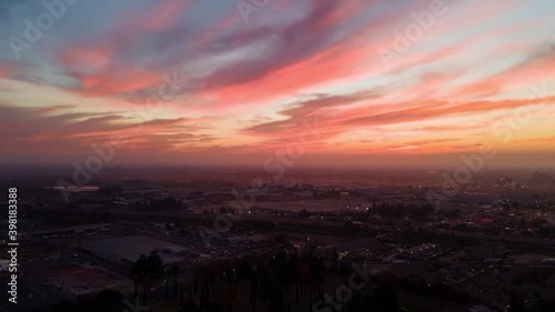 Hyperlapse Miniature Effect Tilt Shift of Sunset over Small Town with cars and traffic