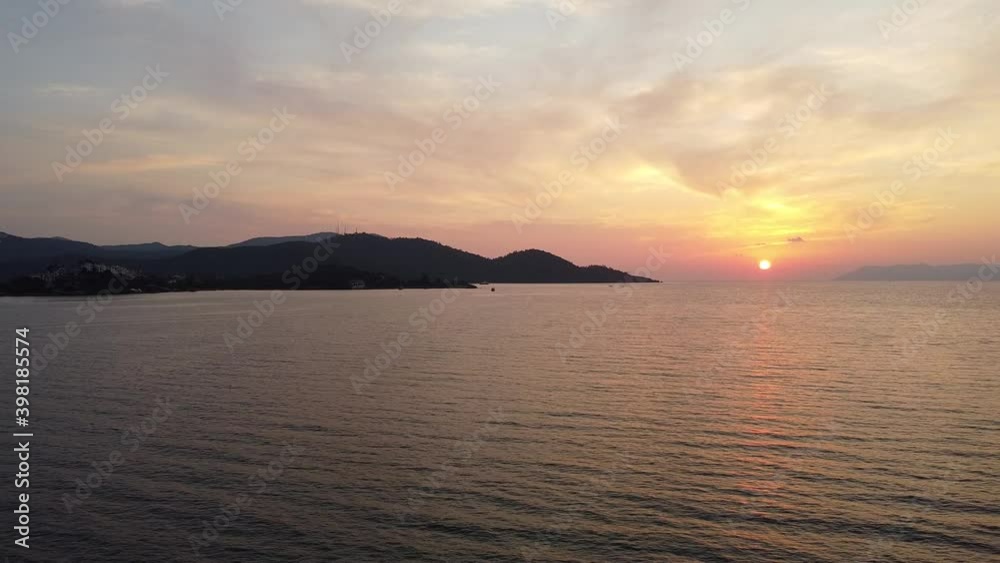 A beautiful sunset above the sea reccorded by drone in Calis Beach, Fethiye, Turkey. A beautiful sunset above the sea reccorded by drone in Calis Beach, Fethiye, Turkey.
