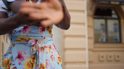 Passionate afro couple training dance on street. Dancers moving with rhythm