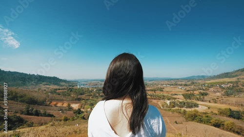 young Japanese teen girl brunette women tourist adult woman asian mature looking the sky outdoors on a hike mountains camping taking a photo with lover viewpoint at Chiang mai, Mon Jam, Thailand.