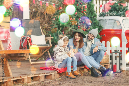 Happy family celebrating Christmas outdoors