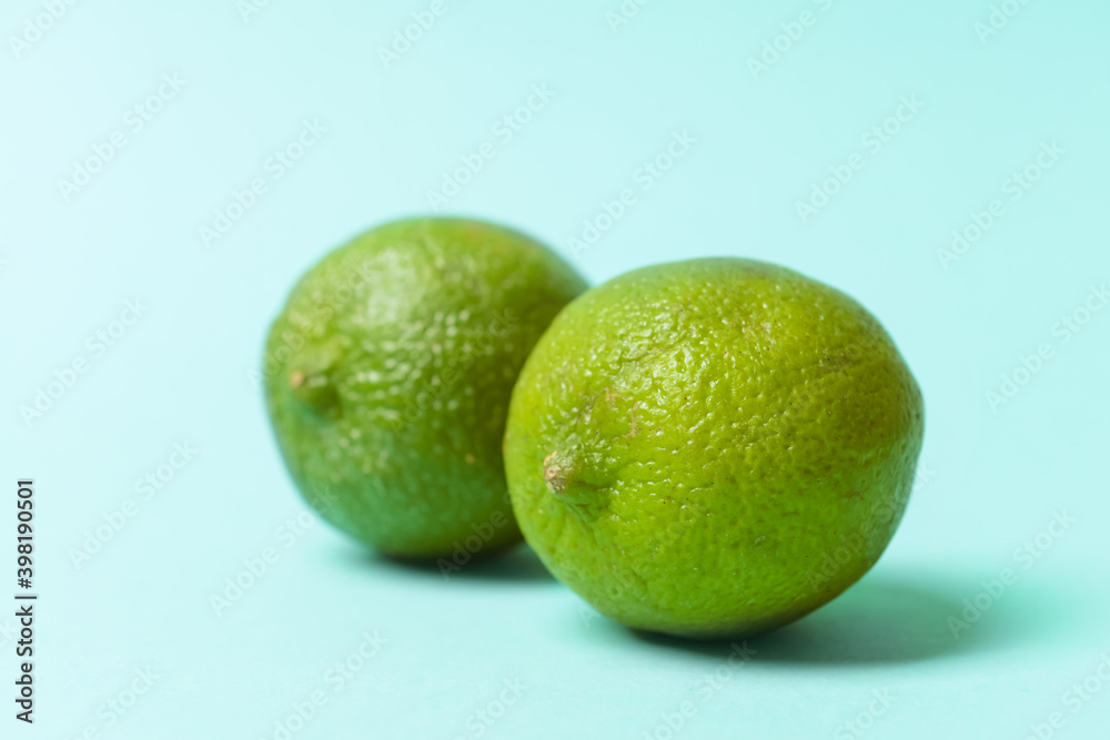 Fresh juicy limes on color background. Erotic and female health care concept Fresh juicy limes on color background. Erotic and female health care concept