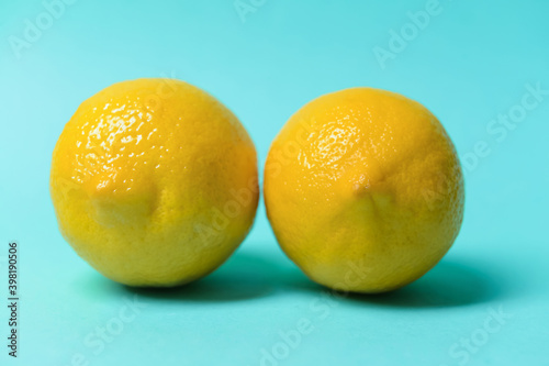 Fresh juicy lemons on color background. Erotic and female health care concept