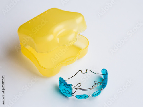 Kids orthodontic retainer for teeth with case.
