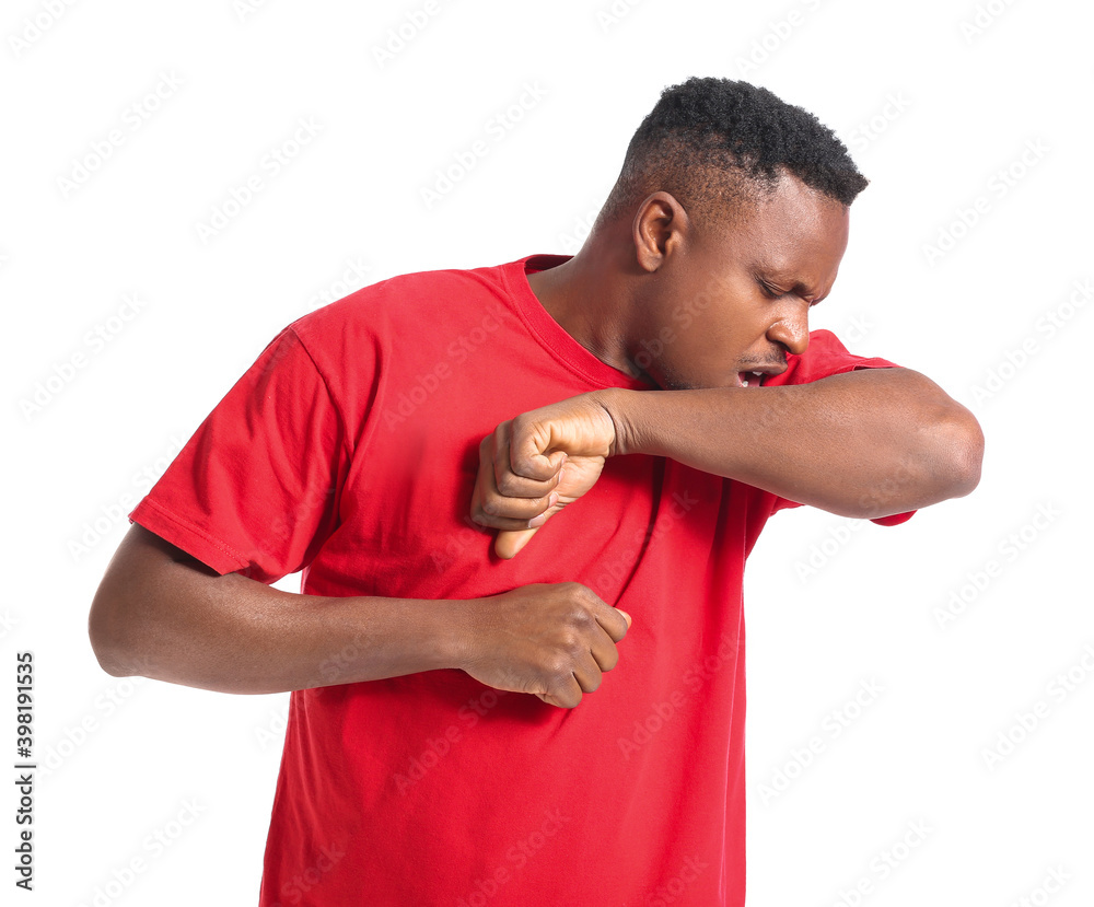 Coughing African-American man on white background