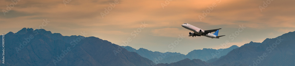 Panoramic view with airplane taken off above mountains, Middle East Panoramic view with airplane taken off above mountains, Middle East