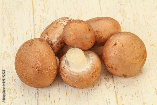 Raw Brown Champignons over background