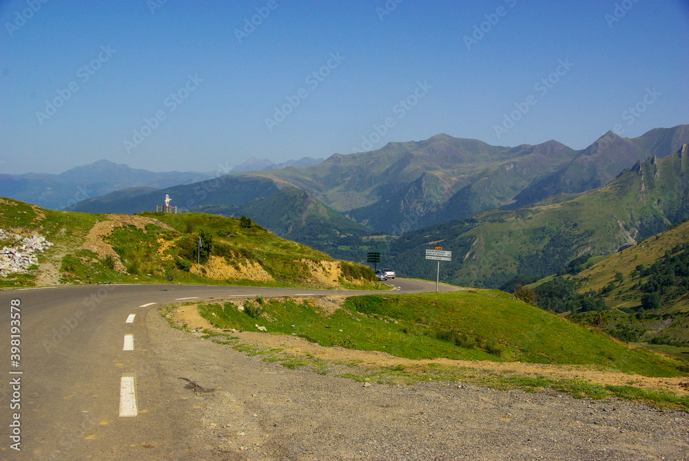 Mountain road in the French Pyrenees with mountains in the background. High quality photo. Copy Space for characters or letters