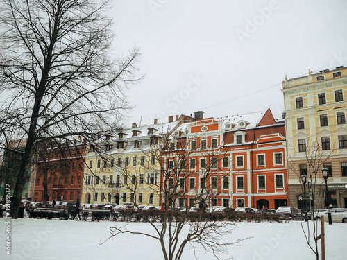 Picturesque street with colorful houses in the old town of Riga in winter at Christmas time, Latvia