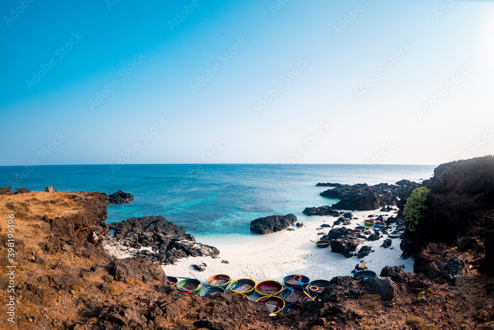 Be island ( small island, Bo Bai island ) with local colorful basket boats at Ly Son island, Quang Ngai Province, Viet Nam Be island ( small island, Bo Bai island ) with local colorful basket boats at Ly Son island, Quang Ngai Province, Viet Nam