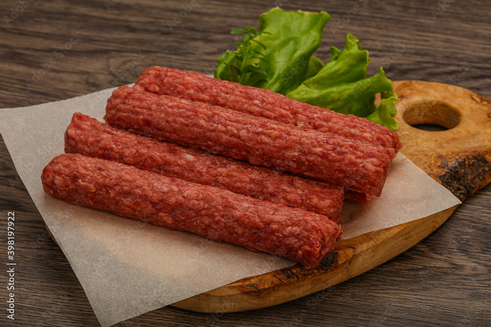 Raw beef sausages with spices
