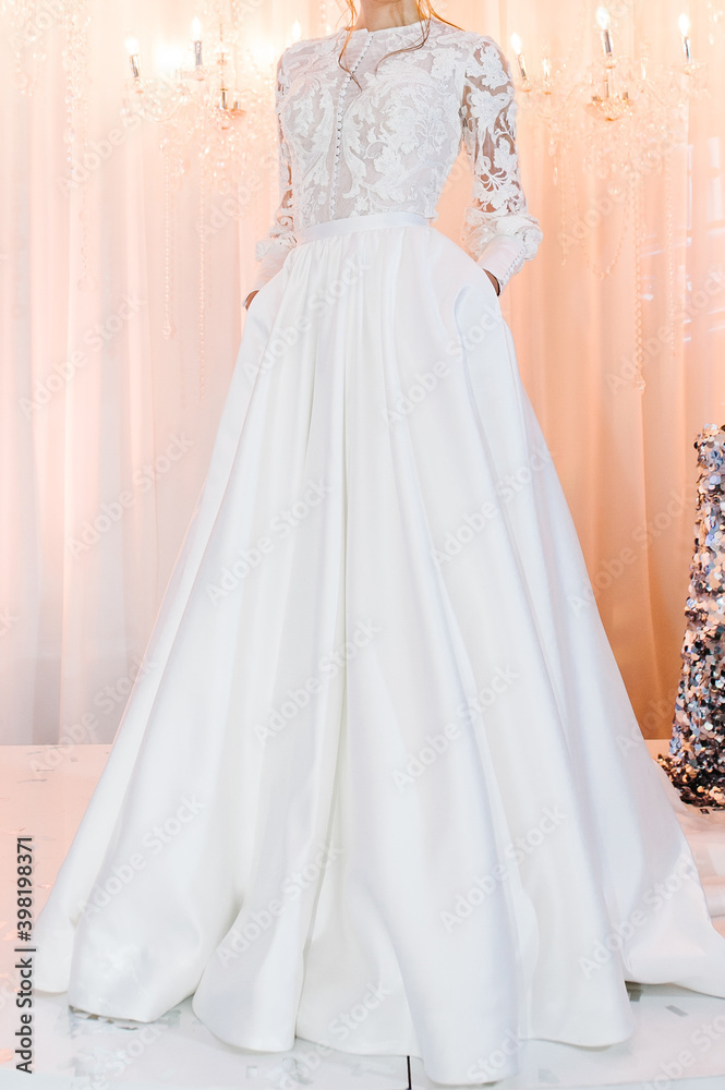 Bride in expensive, luxury dress at ceremony in wedding day. Woman, details of models on the collection. Bride in expensive, luxury dress at ceremony in wedding day. Woman, details of models on the collection.
