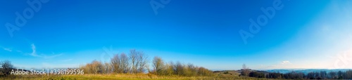 panorama of late autumn in the mountains against a clear blue sky