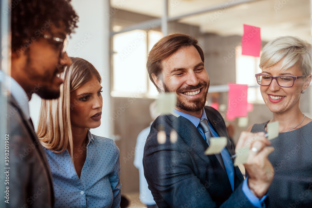 Happy success business people working, brainstoming together in office on meeting Happy success business people working, brainstoming together in office on meeting
