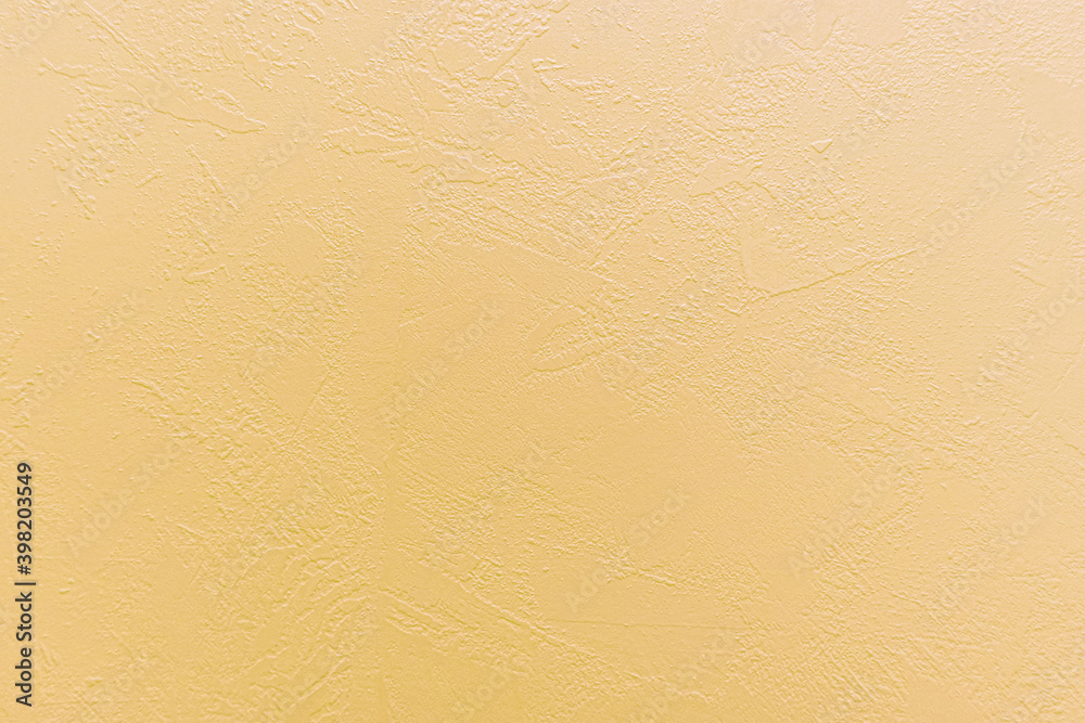 Orange concrete background with abstract textured pattern applied to the surface