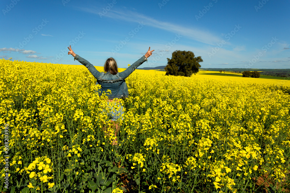 Farm girl in bumper crop of canola