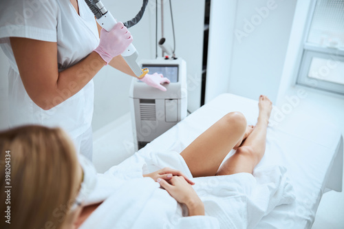 Doctor preparing her patient for the laser treatment