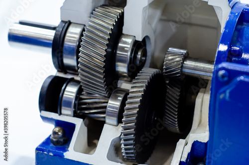 Photos Close-up of cross-section helical gearbox with motor