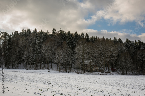 The tavern Felsenkeller Etzelwang hidden in forest on cloudy winter day © Robert Ruidl