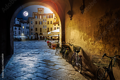 The Sun and the Moon Symbolizing the Passing of Time seen Though an Arch in in Lucca, Itlay