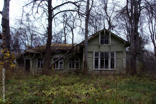 A very old, dilapitated, abandoned house, on a dark overcast day. © Anna
