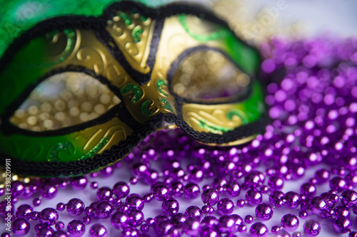 Fotografiet Mardi gras beads and mask close up