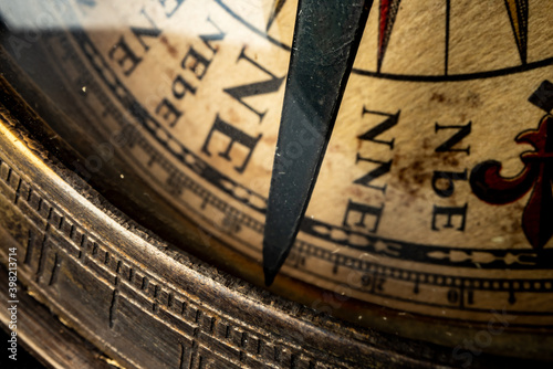 Old metal watch dial in dark macro photo