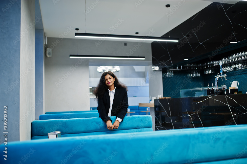 Gorgeous indian woman wear formal posing at cafe. Gorgeous indian woman wear formal posing at cafe.