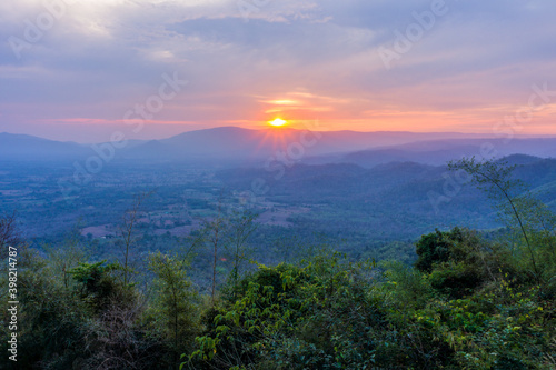 Sunset behind mountain at Pha Kep Tawan viewpoint. Scenery view in Wang Nam Khiao, Nakhon Ratchasima, Thailand, Southeast Asia.