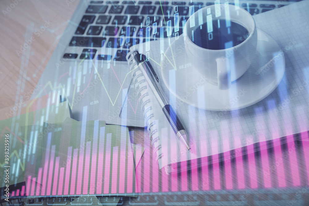 Double exposure of forex chart drawing and desktop with coffee and items on table background. Concept of financial market trading Double exposure of forex chart drawing and desktop with coffee and items on table background. Concept of financial market trading