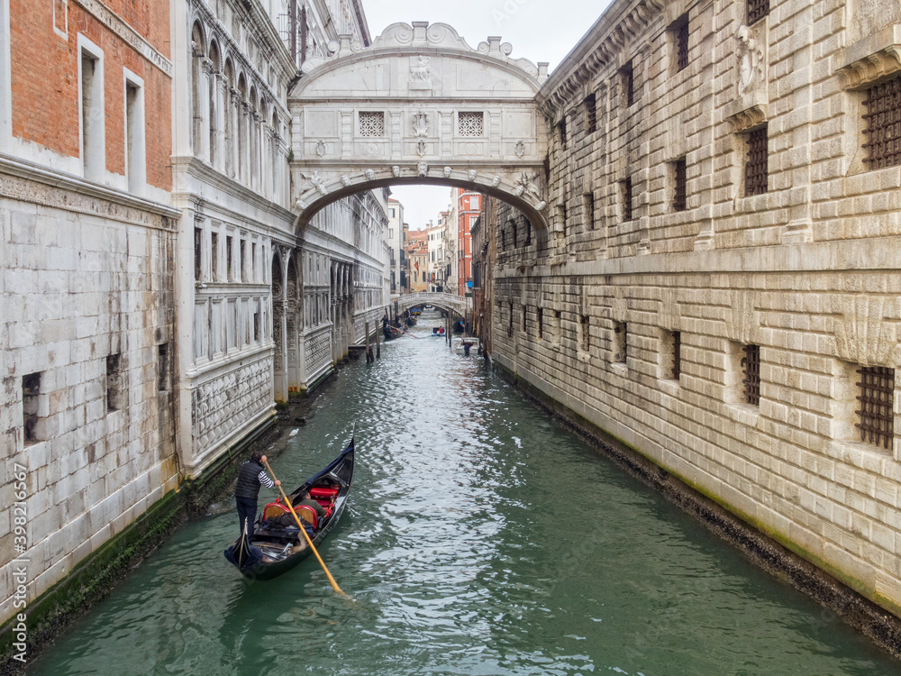 A gondola approaches the Bridge of Sighs on the Rio del Palazzo - Venice, Veneto, Italy