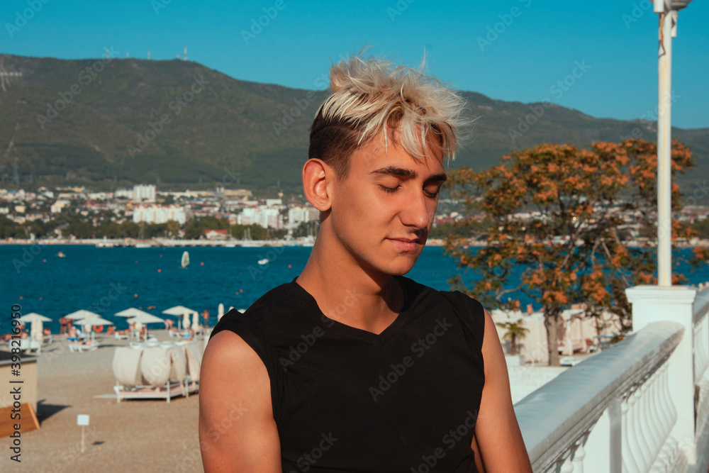 Fototapeta premium Young tourist is resting at the sea.