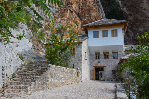 Beautiful view of the Dervish House under the rock in Blagaj. Bosnia and Herzegovina photo