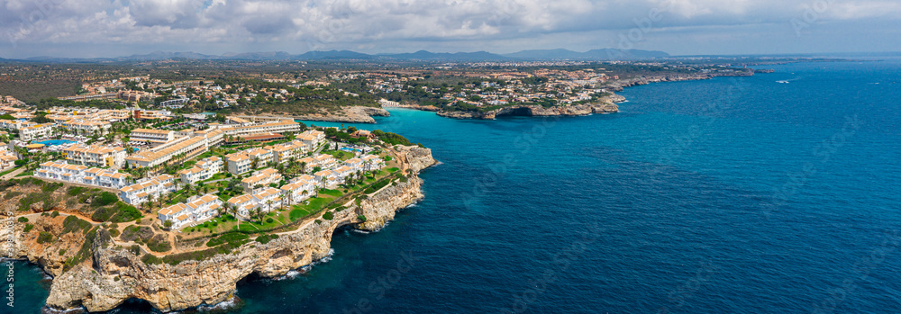 An aerial panorama of Cala Romantica on Mallorca island in Spain