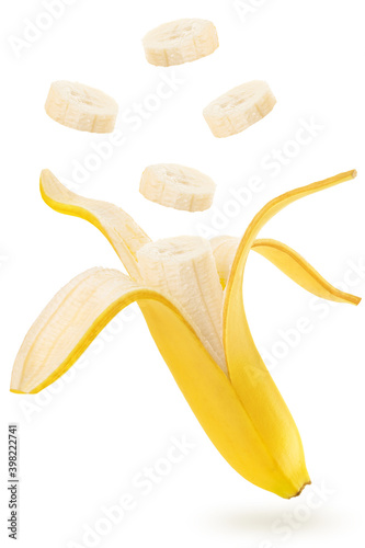 slices of banana flying over a peeled banana isolated on a white background
